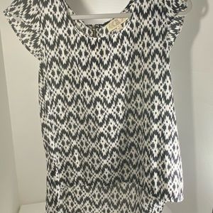 This is a light weight, black and white blouse. Great with black dress pants!